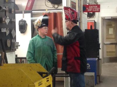 A LCC technical education student listens intently during welding lab