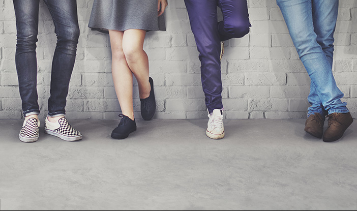 legs of men and women in casual wear