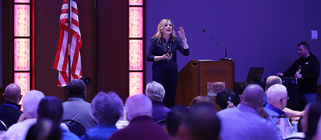 Patty speaking at a conference